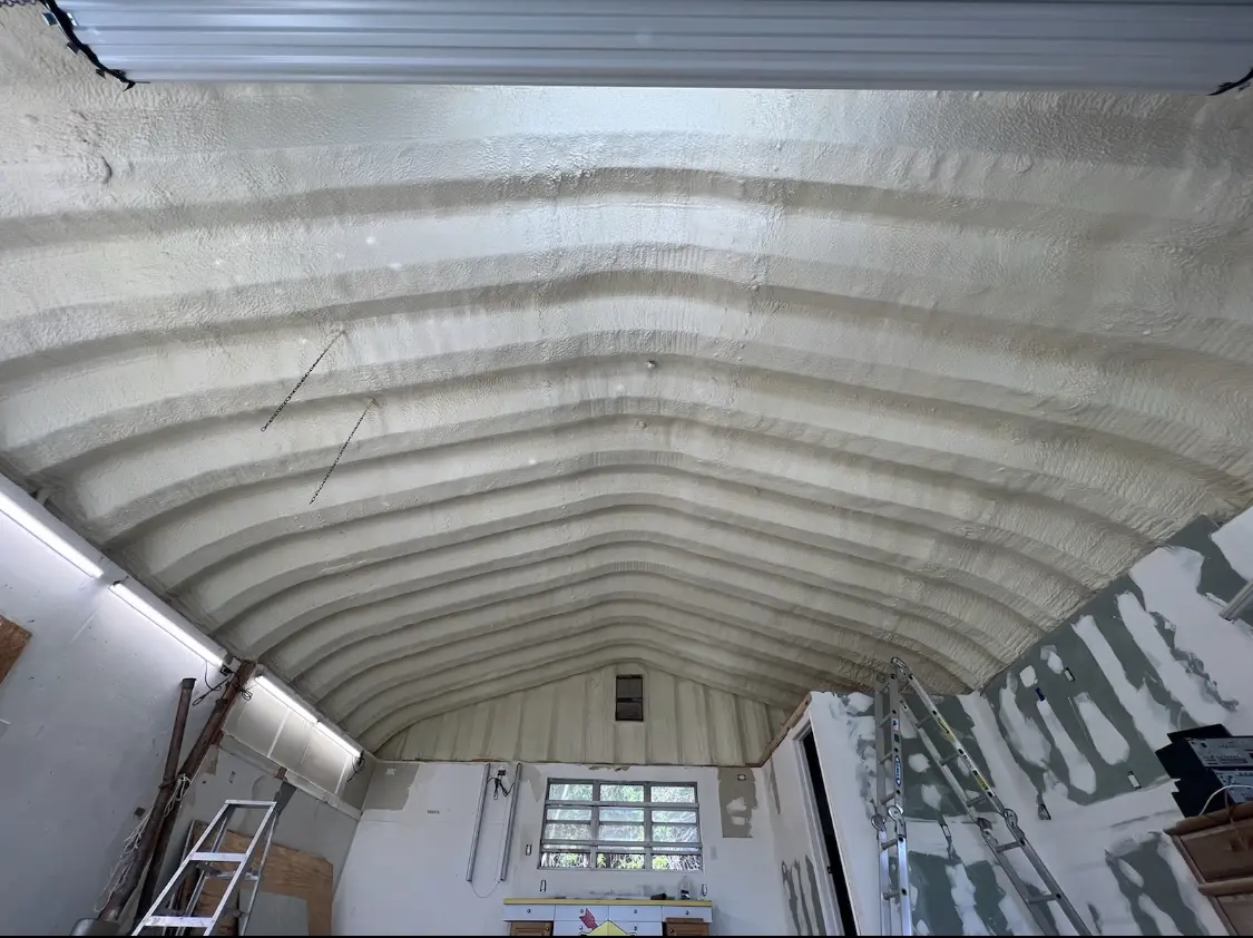 Spray polyurethane foam applied to the underside of a metal roof deck in Los Altos Hills